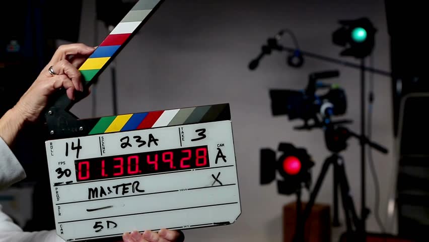 Movie Filming Device. Hands use movie production clapper board at studio. Clapperboard for Video and Audio Sync. Film Production Process. Behind the Scene.