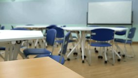 Empty classroom with chalkboard and rows of desks with chairs. Break at school and blackboard in high school thailand, vintage tone education concept - Powered by Shutterstock - Get 15% off with code: PIKWIZARD15