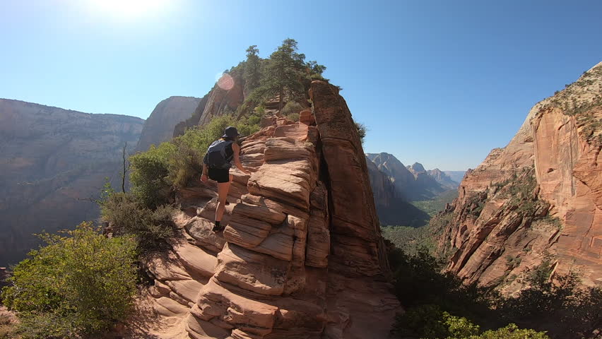 Panoramic view of Zion National Park featuring the Angels Landing hiking trail with breathtaking cliffs and deep canyons.