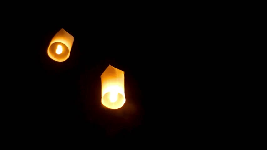 Charming Sky Lanterns Loy Krathong Festival is a highly revered traditional celebration in Thailand, 4k animated video of lanterns in the night sky