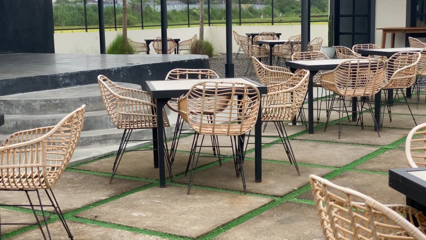 Comfortable rattan tables and chairs outdoors in a coffee shop, Interior footage