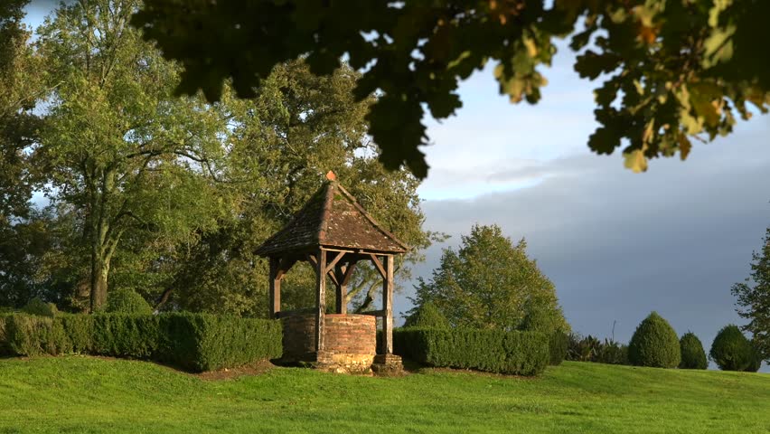 Ancient brick built well located in the garden of Morlanne