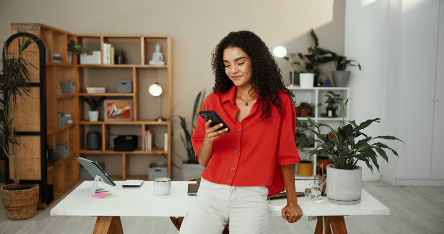 Woman, phone and happy with texting for remote work from home office on break, chat and laugh at meme. Person, freelancer and writer on smartphone with smile for contact, notification or social media
