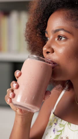 Woman, drinking and healthy smoothie at house of diet wellness, nutrition protein and fruit shake. Female person, detox and organic ingredients for weight loss, breakfast juice and digestion benefits