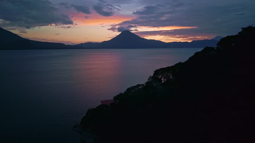 Beauty sunrise over a volcano in a lake in Guatemala