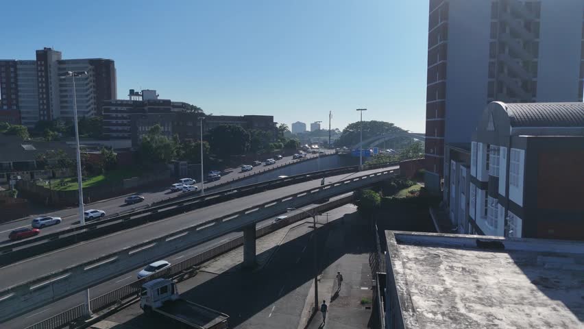 Aerial Footage of Tollgate Bridge in Durban on a Sunny Morning – Scenic Urban Skyline and Traffic Flow