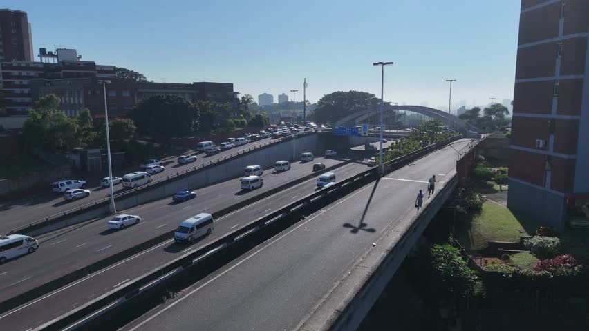 Aerial Footage of Tollgate Bridge in Durban on a Sunny Morning – Scenic Urban Skyline and Traffic Flow