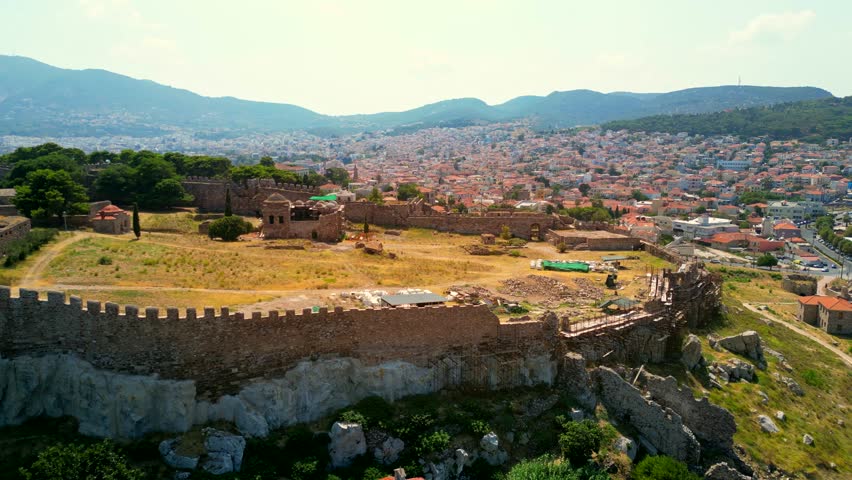 Drone shot orbiiting the Castle of Mytilene, Greece, on a bright sunny day.