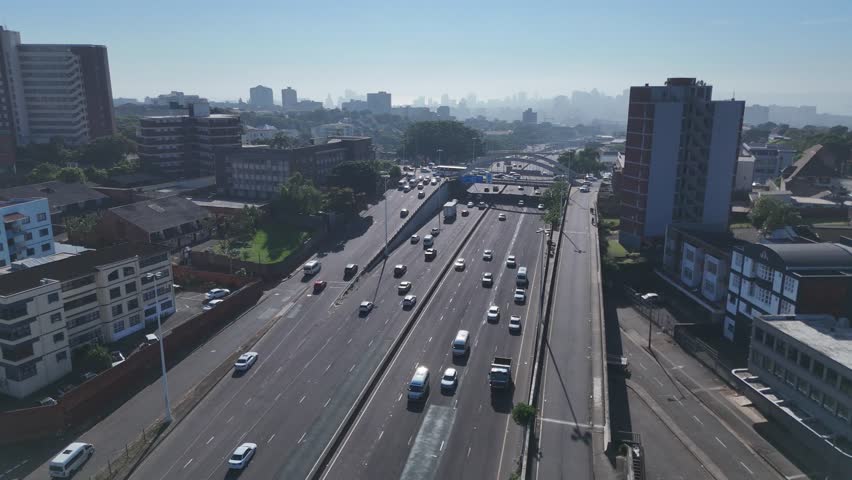 Aerial Footage of Tollgate Bridge in Durban on a Sunny Morning – Scenic Urban Skyline and Traffic Flow