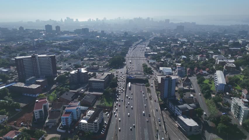Aerial Footage of Tollgate Bridge in Durban on a Sunny Morning – Scenic Urban Skyline and Traffic Flow