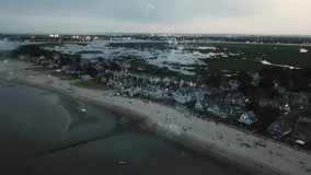 fireworks celebration of 4th July in Milford coastal city in New Haven County, Connecticut, United States drone rotate around scenic beach party - Powered by Shutterstock - Get 15% off with code: PIKWIZARD15