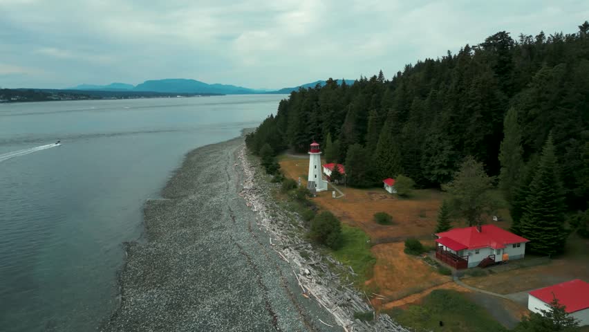 aerial shot over Cape Mudge Lighthouse on Quadra Island near Campbell river in Vancouver Island on an overcast day, British Columbia, Canada