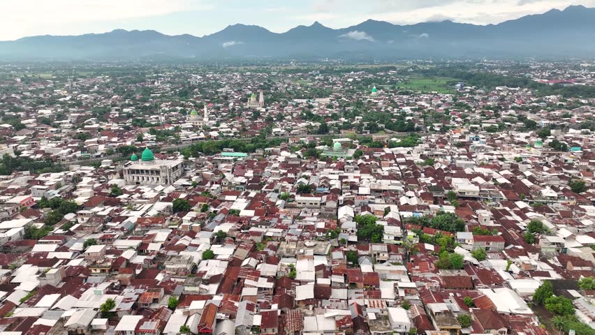 Populated area of Indonesian city Mataram with houses and cultural landmarks. Indonesia