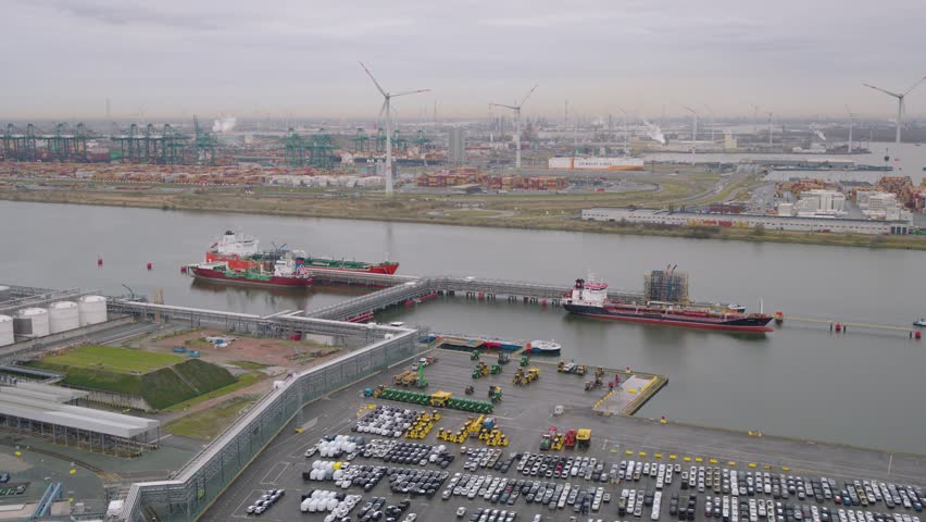 Cargo vessels and endless trade zone in harbor, Belgium, aerial view