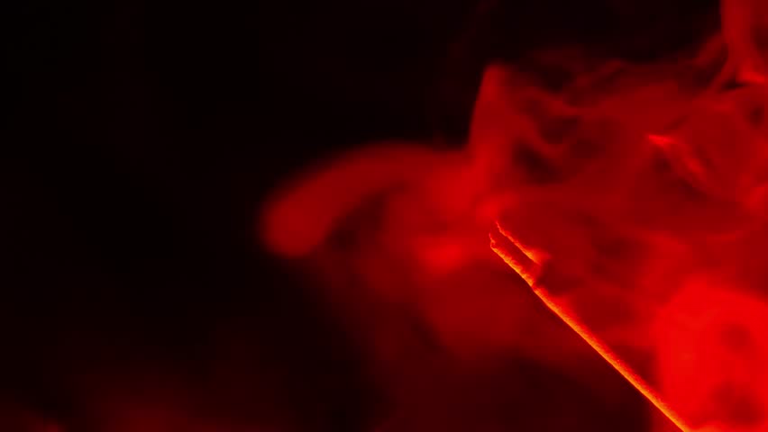 Smoky wallpaper in black and red tones.Magic and sorcery.Witchcraft and magic wallpaper. Dark atmosphere.