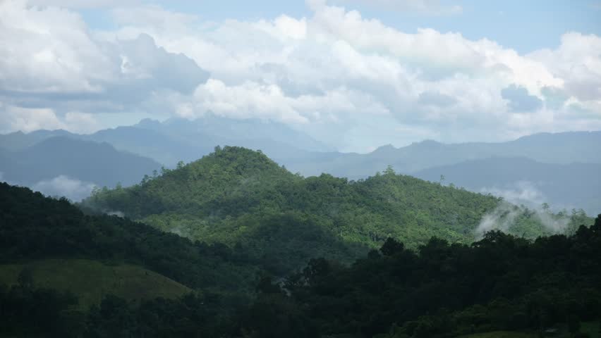 Landscape of greenery hills and cloudy sky