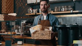 Smiling Caucasian waiter man guy worker showing food basket barista offering to customer fresh bread bakery catering in cafeteria small business cafe restaurant entrepreneur male working coffee shop - Powered by Shutterstock - Get 15% off with code: PIKWIZARD15