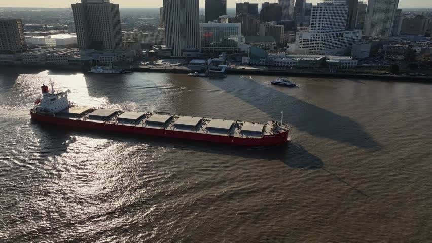 Tanker cruising by the city of New Orleans drone view