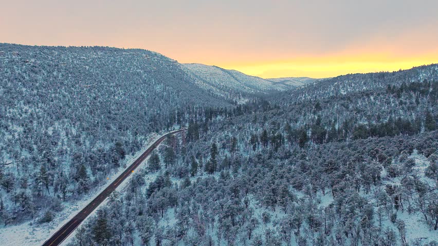 Winter wonderland along the highway at Jacob Lake, Arizona, near the Grand Canyon and Utah during a sunset, near Page, Flagstaff, Zion National Park, Kaibab Forest, cars on the street