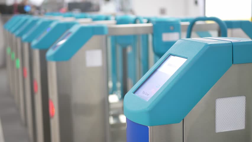 view to contactless emv card reader at the exit door on the bus public transportation in singapore while bus moving.Ticket validator device scanning card reader in public transport to pay for riding