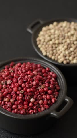 White allspice in a ceramic bowl on a dark concrete background