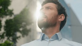 Close up smiling happy Caucasian middle aged adult man thinking looking around male guy business employer businessman manager inspired in city office building sun sky sunny insurance hope religion - Powered by Shutterstock - Get 15% off with code: PIKWIZARD15