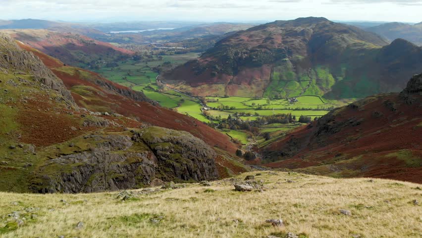 Scenic aerial view of a valley in the Lake District, famous for its glacial ribbon lakes and rugged mountains. Popular vacation destination in Cumbria, North West England, United Kingdom.