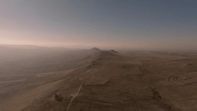 aerial view of time and space sculpture park including sculptures: A Day On Earth, Presence, Grind, and the desert yellow landscapes of cappadocia - Powered by Shutterstock - Get 15% off with code: PIKWIZARD15