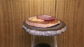 A close up footage of wood epoxy logs on a wood log epoxy table slowly rotating on a blue background - Powered by Shutterstock - Get 15% off with code: PIKWIZARD15