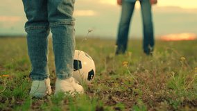 Child kicks ball father. Dad child play together, teamwork. Weekend. Happy family playing football. Family have fun playing soccer ball on lawn in park. Young family sport soccer team playing outdoors - Powered by Shutterstock - Get 15% off with code: PIKWIZARD15