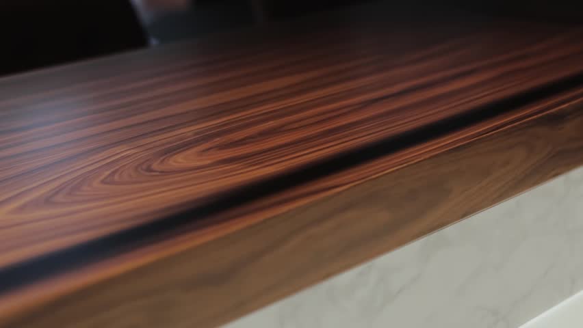 Close-up shows off an elegant surface made of beautiful wood and marble