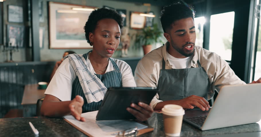 Laptop, meeting and tablet with people in coffee shop for accounting, budget or planning. Computer, documents and finance with small business owner people in cafe or restaurant for management