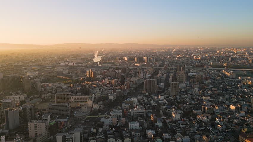 south osaka city aerial view drone at sunrise,flying over residential taisho ward - Powered by Shutterstock - Get 15% off with code: PIKWIZARD15