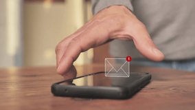 person picking up mobile phone from table showing incoming mail icon,male hand picks up smartphone displaying 3d email symbol on the screen - Powered by Shutterstock - Get 15% off with code: PIKWIZARD15