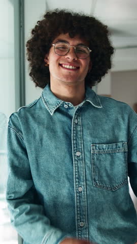 Arms crossed, face and smile of designer man at window in office for break from programming project. Afro, glasses and graphic design with happy person in creative workplace for professional coding