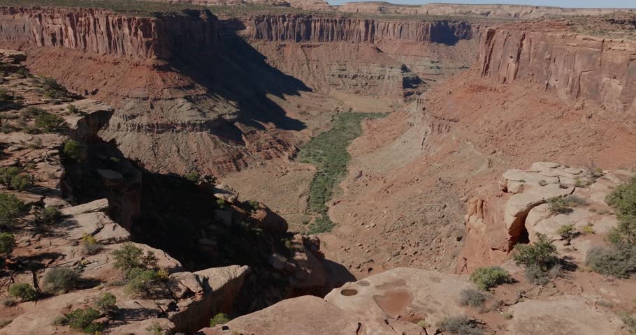 Majestic canyon landscape in Moab, Utah, showcasing a vast valley and rugged terrain