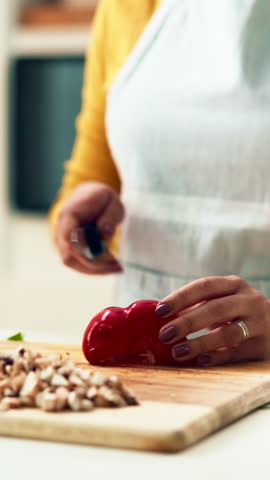Hands, chopping board and woman with knife, vegetables or meal plan with culinary skills. Closeup, home or person in kitchen, lunch or vegan with ingredients, cutting or recipe for diet or cooking
