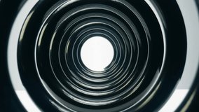 Zoom in through a black metal shock absorber spring on a white background. Close-up of the car part. Smooth flying through spiral pattern. Macro studio shot of a coil - modern car suspension part. - Powered by Shutterstock - Get 15% off with code: PIKWIZARD15