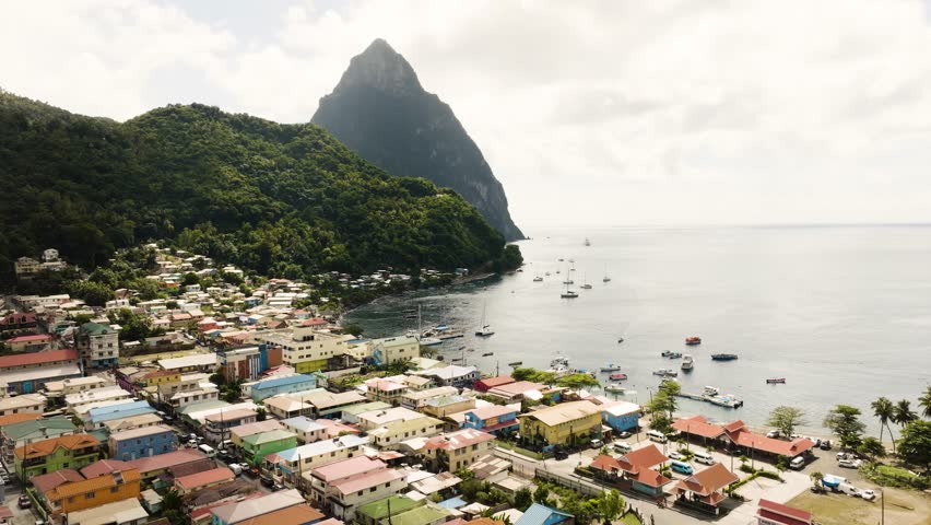 Soufriere Saint Lucia drone shot of Petit Piton over the Caribbean Sea with boats on the bay