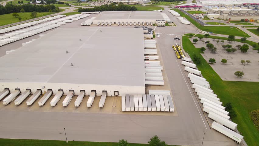 Distribution center aerial view with multiple loading docks and trucks in Georgetown Kentucky, USA