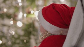 Portrait of a happy nordic blonde girl dressed as Santa Claus at Christmas - Powered by Shutterstock - Get 15% off with code: PIKWIZARD15