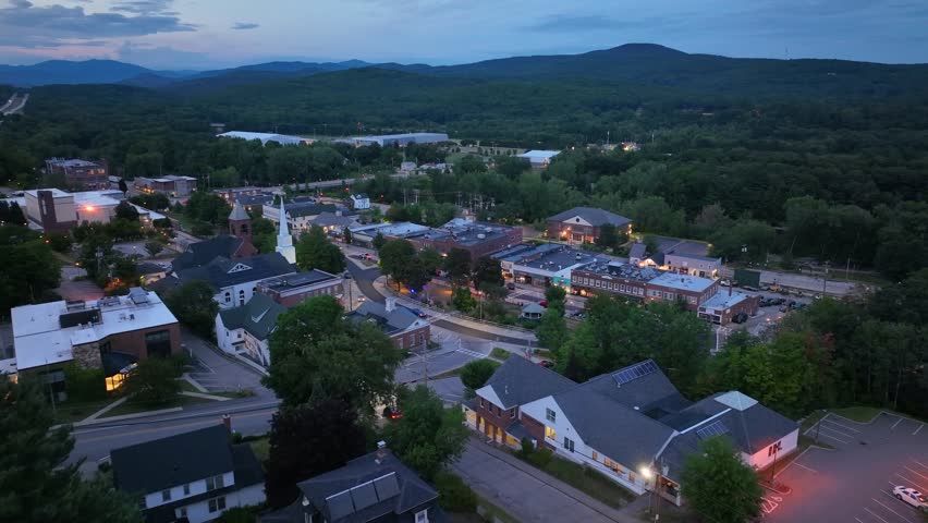 Main Street aerial view at sunset with White Mountain National Forest at the background in summer in town of Plymouth, New Hampshire NH, USA. 