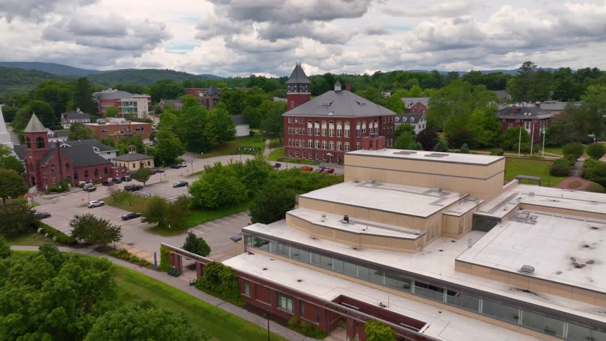 Main Street aerial view with White Mountain National Forest at the background in summer in town of Plymouth, New Hampshire NH, USA. 