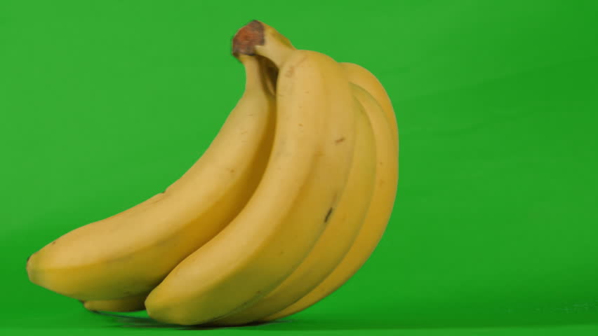 Bunch of Bananas Rocking on Green Screen in Slow Motion. Chromakey Background to Isolate and Add to Your Video. ProRes 4K.