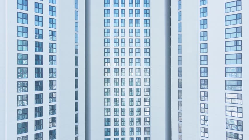 Background of modern facade of building with many windows, front view.