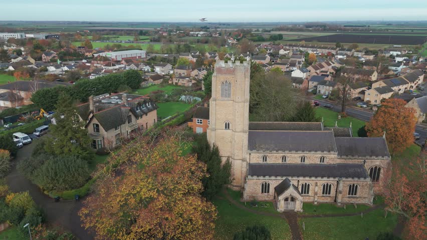 Littleport church with surrounding village, captured on an autumn day, aerial view