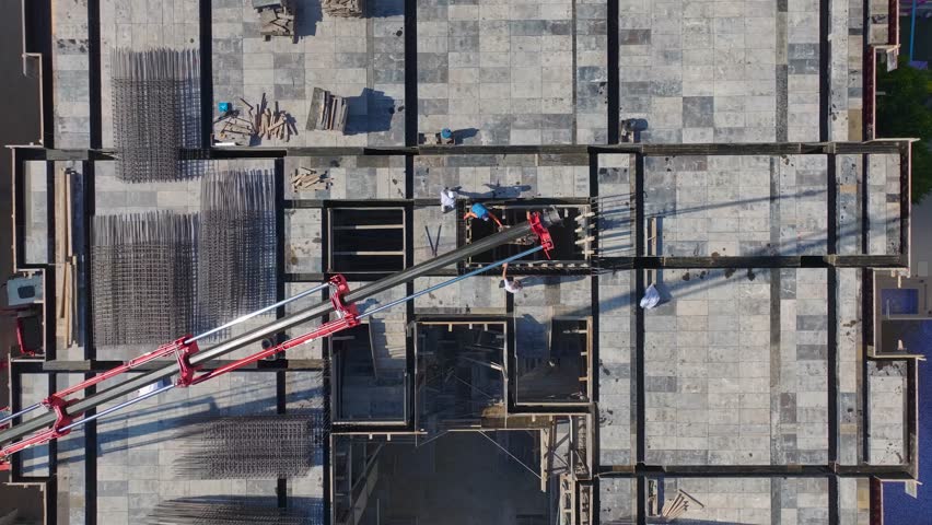 Aerial View: Metal framework and concrete pouring combine to create strong and stable foundations.A critical stage of construction progress.