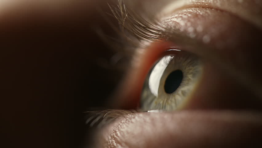 Side view of Beautiful blue eye, opening eyes, extreme macro close-up view. Perspective, perception, and eyesight concepts. New opportunities