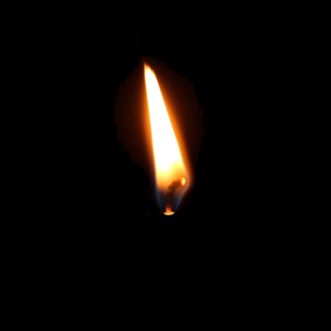 Realistic candle flame flickering in the dark. Warm glow, soft movements, subtle lighting, natural flicker, smooth oscillation, cozy ambiance, cinematic warmth, delicate flame, serene atmosphere.