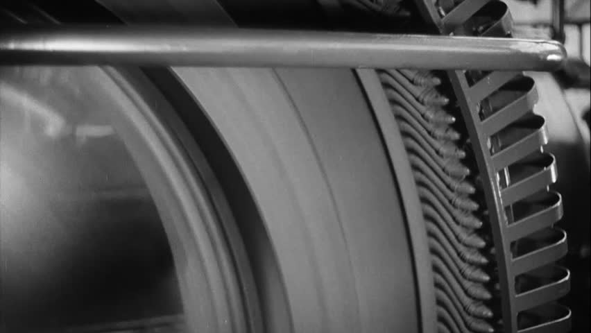 Big gear spinning with high speed in the factory black white footage 